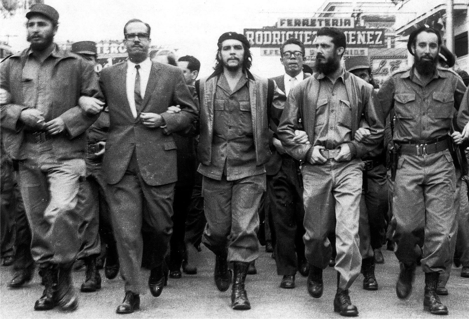 Fidel Castro (far left) and Che Guevara (middle) marching in Havana